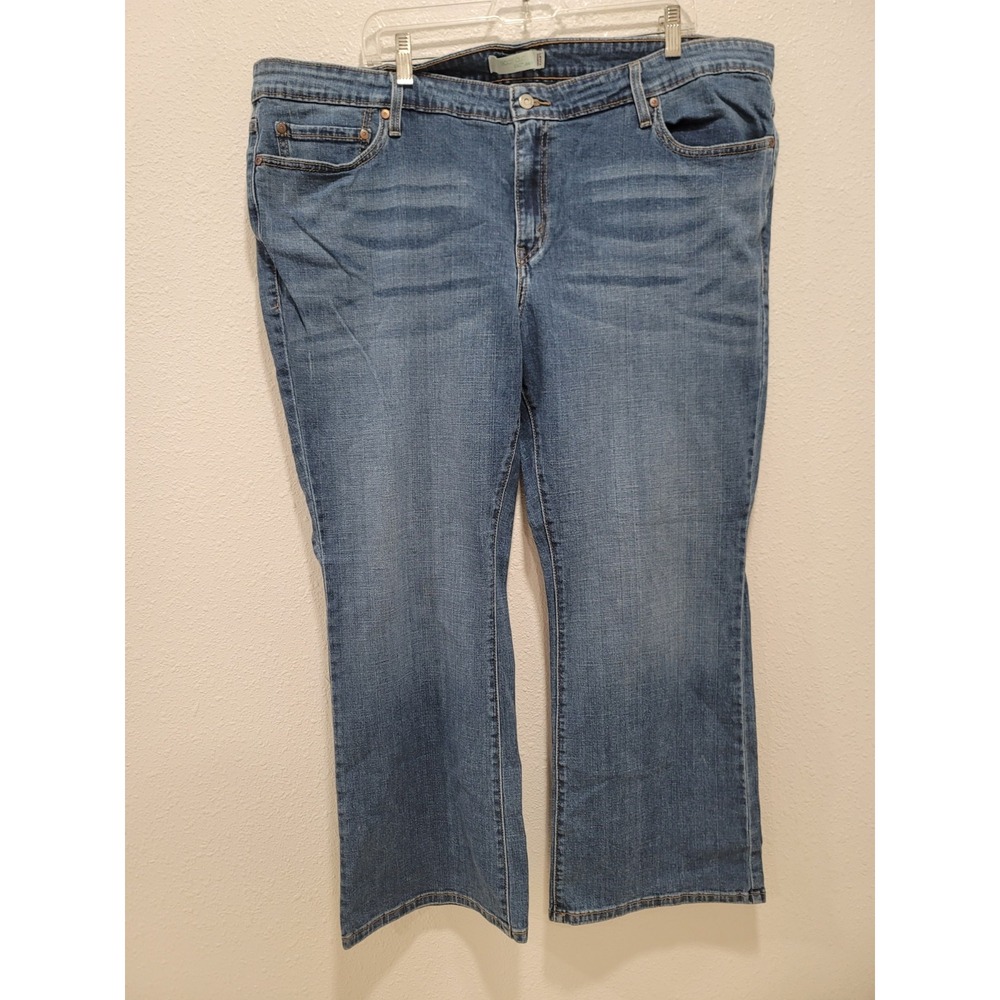Levi's 590 jeans boot cut size 22. back pocket with buttons. destressed look